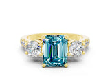 Yellow gold Three-Stone Emerald Cut Blue Topaz Pavé Band with Four-Prong Setting