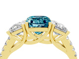 Yellow gold Three-Stone Emerald Cut Blue Topaz Ring with Pavé Band and Prong Setting_16