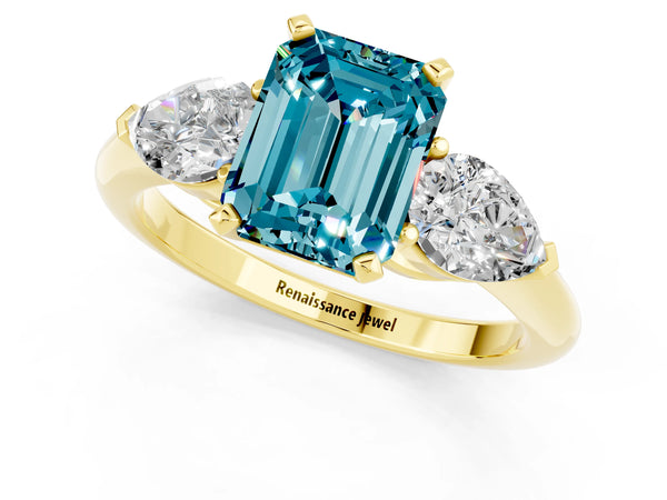 Yellow gold Three-Stone Emerald Cut Blue Topaz Ring with Pear Side Stones and Four-Prong Setting