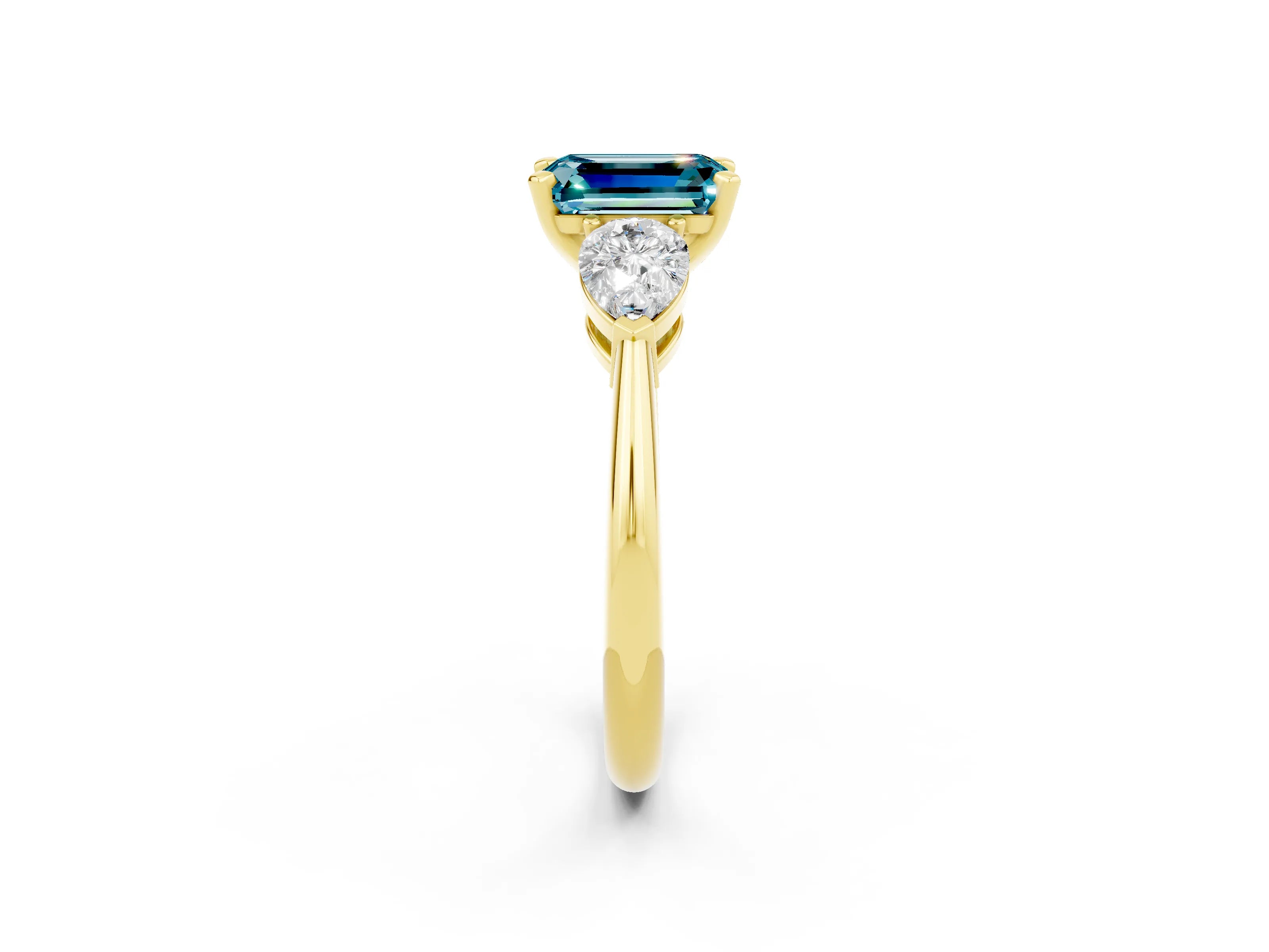 Yellow gold Three-Stone Emerald Cut Blue Topaz Ring with Pear Side Stones and Four-Prong Setting_2