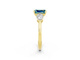 Yellow gold Three-Stone Emerald Cut Blue Topaz Ring with Pear Side Stones and Four-Prong Setting_2