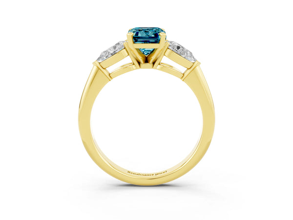 Yellow gold Three-Stone Emerald Cut Blue Topaz Ring with Pear Side Stones and Four-Prong Setting