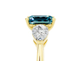 Yellow gold Three-Stone Emerald Cut Blue Topaz Ring with Pear Side Stones and Four-Prong Setting_5