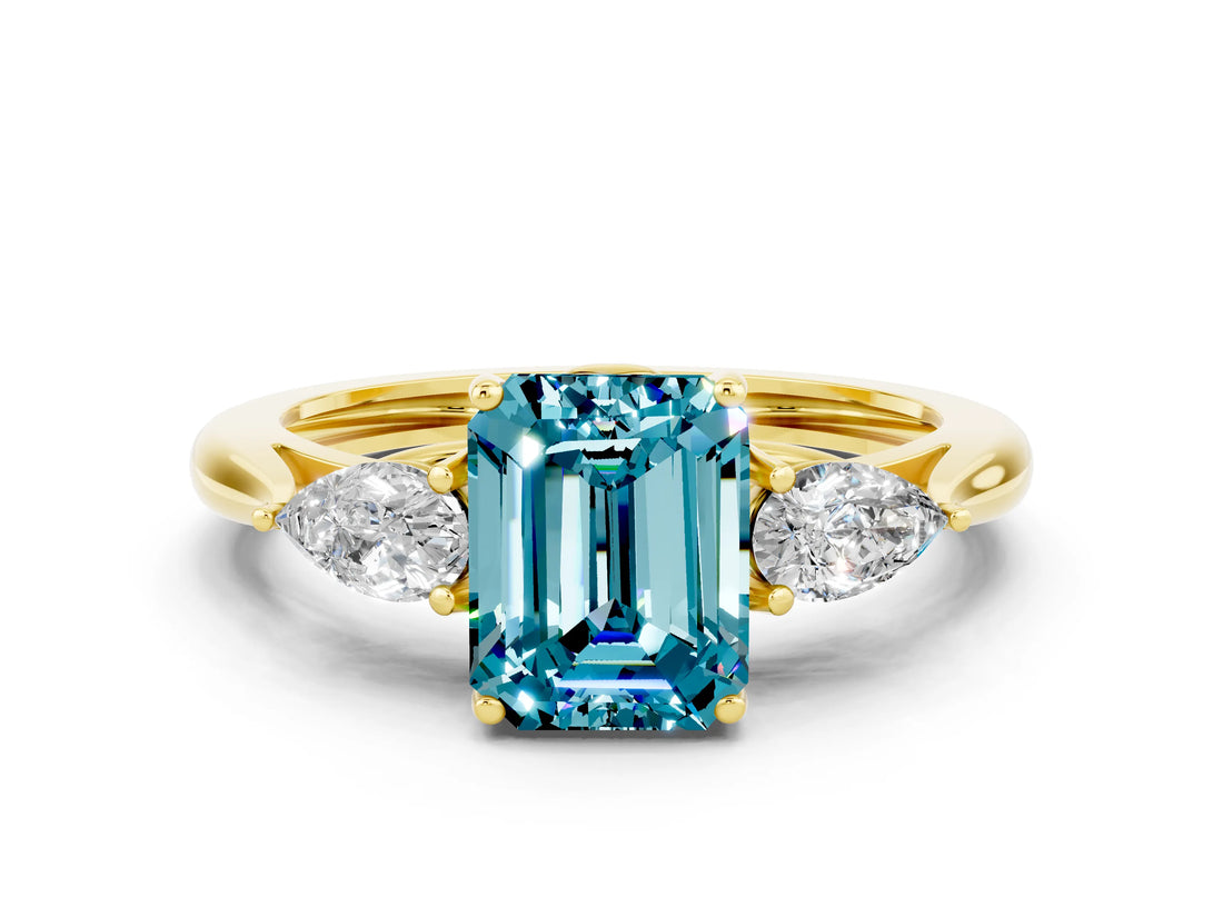 Yellow gold Three-Stone Emerald Cut Blue Topaz Ring with Pear  Side Stones in Four-Prong Setting_12