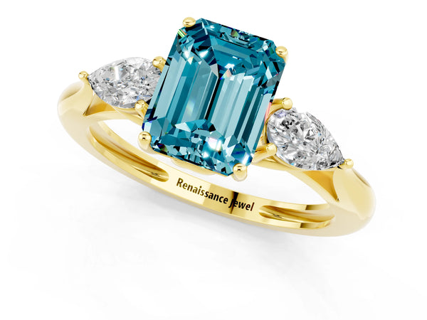 Yellow gold Three-Stone Emerald Cut Blue Topaz Ring with Pear  Side Stones in Four-Prong Setting