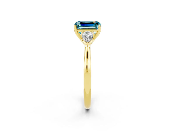 Yellow gold Three-Stone Emerald Cut Blue Topaz Ring with Pear  Side Stones in Four-Prong Setting