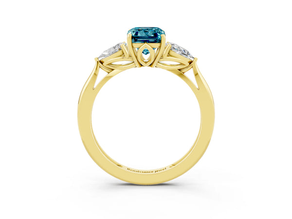 Yellow gold Three-Stone Emerald Cut Blue Topaz Ring with Pear  Side Stones in Four-Prong Setting