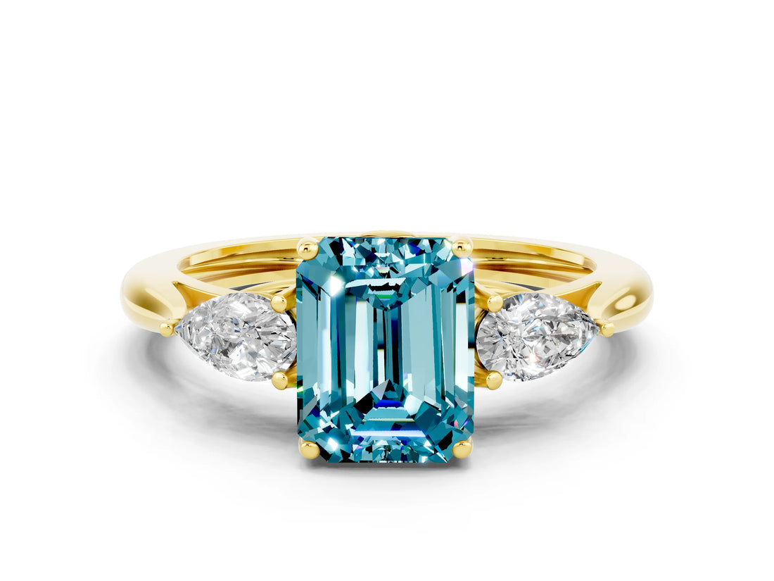 Yellow gold Three-Stone Emerald Cut Blue Topaz Ring with Pear  Side Stones in Four-Prong Setting_36