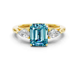 Yellow gold Three-Stone Emerald Cut Blue Topaz Ring with Pear  Side Stones in Four-Prong Setting_36
