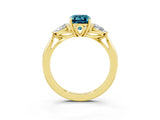 Yellow gold Three-Stone Emerald Cut Blue Topaz Ring with Pear  Side Stones in Four-Prong Setting_39