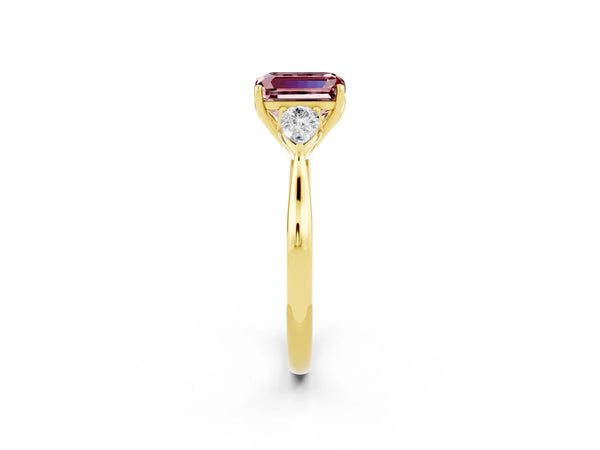 Yellow gold Three-Stone Emerald Cut Cut Diamond Ring with Pear Side Stones in Four-Prong Setting