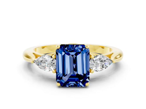 Yellow gold Three-Stone Emerald Cut Cut Diamond Ring with Pear Side Stones in Four-Prong Setting