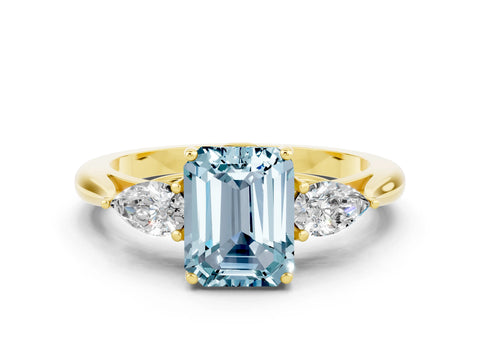 Yellow gold Three-Stone Emerald Cut Cut Diamond Ring with Pear Side Stones in Four-Prong Setting