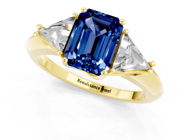 Yellow gold Three-Stone Emerald Cut Blue Sapphire Engagement Ring with Trillion Side Stones and Prong Setting
