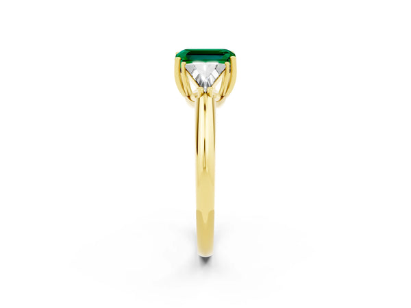 Yellow gold Three-Stone Emerald Cut Emerald Engagement Ring with Trillion Side Stones and Prong Setting
