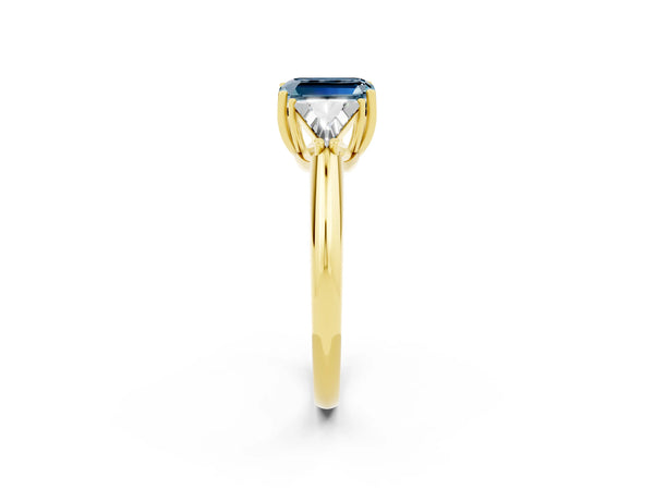 Yellow gold Three-Stone Emerald Cut Aquamarine Engagement Ring with Trillion Side Stones and Prong Setting