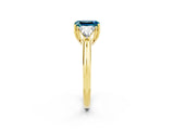 Yellow gold Three-Stone Emerald Cut Cut Diamond Ring with Trillion Side Stones and Four-Prong Setting_2