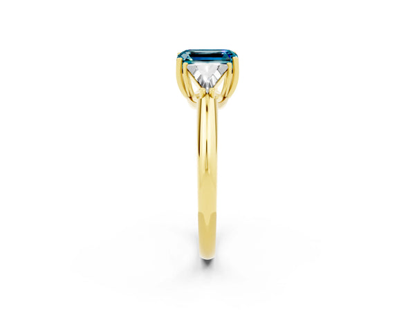 Yellow gold Three-Stone Emerald Cut Cut Diamond Ring with Trillion Side Stones and Four-Prong Setting