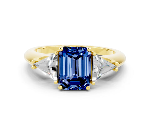 Yellow gold Three-Stone Emerald Cut Cut Diamond Ring with Trillion Side Stones and Four-Prong Setting