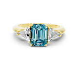 Yellow gold Three-Stone Emerald Cut Cut Diamond Ring with Trillion Side Stones and Four-Prong Setting