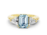 Yellow gold Three-Stone Emerald Cut Cut Diamond Ring with Trillion Side Stones and Four-Prong Setting