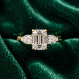 Yellow gold Three-Stone Emerald Cut Diamond Ring with Pear Side Stones and Four-Prong Setting_16