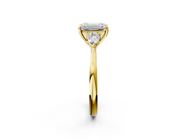 Yellow gold Three-Stone Emerald Cut Diamond Ring with Pear Side Stones in Four-Prong Setting