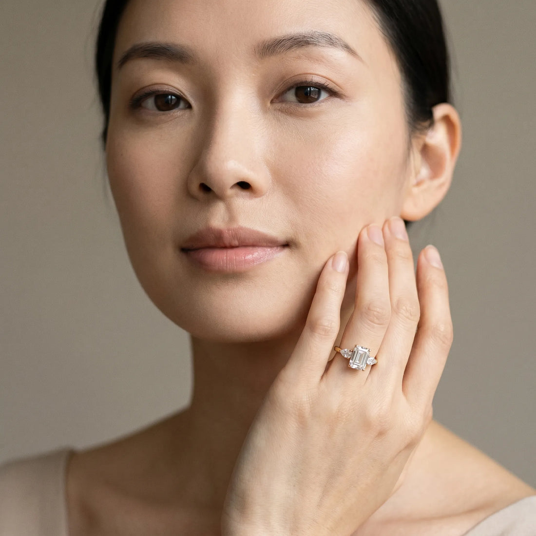 Yellow gold Three-Stone Emerald Cut Diamond Ring with Pear Side Stones in Four-Prong Setting_192