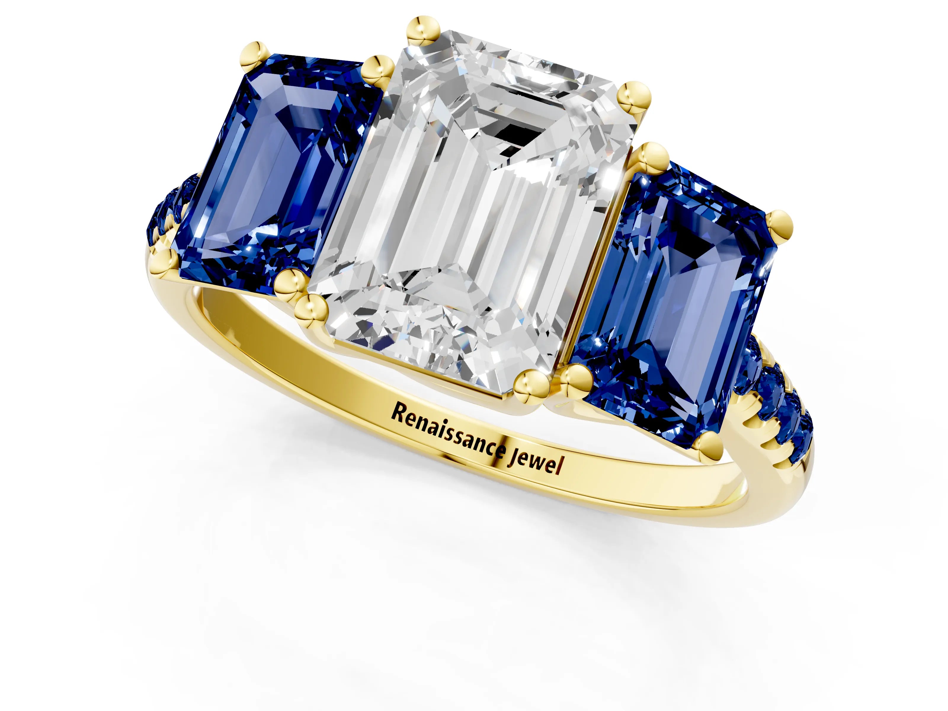 Yellow gold Three-Stone Emerald Cut Diamond Ring with Round with Blue Sapphire side stone Pavé Band and Prong Setting_1