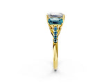 Yellow gold Three-Stone Emerald Cut Diamond Ring with Round with Blue Topaz side stone Pavé Band and Prong Setting_2