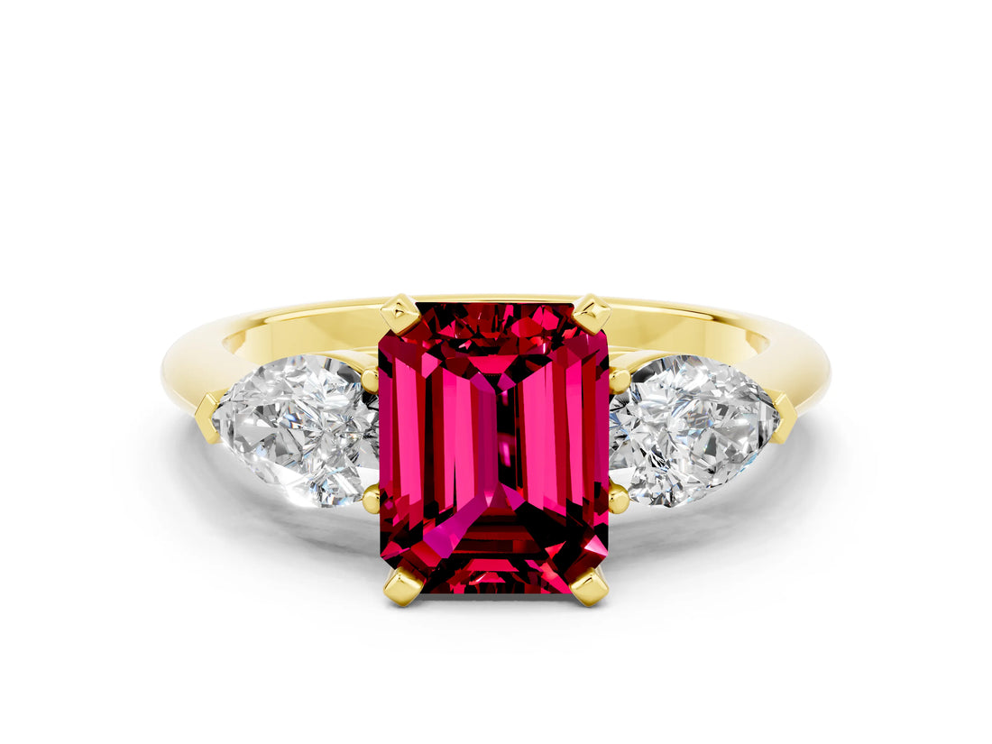 Yellow gold Three-Stone Emerald Cut Garnet Ring with Pear Side Stones and Four-Prong Setting