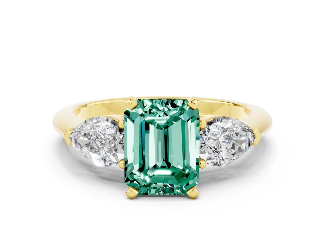Yellow gold Three-Stone Emerald Cut Green Sapphire Ring with Pear Side Stones and Four-Prong Setting