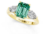 Yellow gold Three-Stone Emerald Cut Green Sapphire Ring with Pear Side Stones and Four-Prong Setting_1
