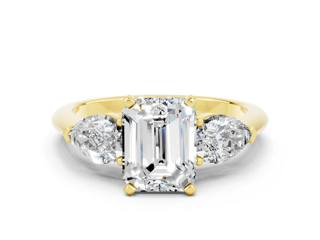 Yellow gold Three-Stone Emerald Cut Moissanite Ring with Pear Side Stones and Four-Prong Setting