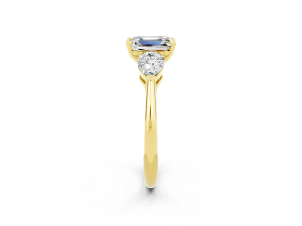 Yellow gold Three-Stone Emerald Cut Moissanite Ring with Pear Side Stones and Four-Prong Setting