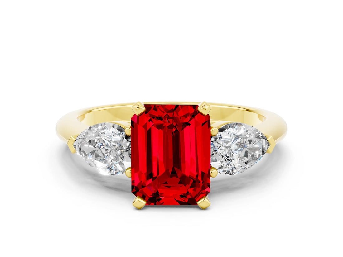 Yellow gold Three-Stone Emerald Cut Ruby Ring with Pear Side Stones and Four-Prong Setting