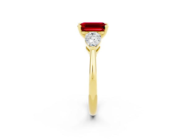 Yellow gold Three-Stone Emerald Cut Ruby Ring with Pear Side Stones and Four-Prong Setting