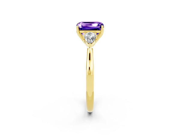 Yellow gold Three-Stone Emerald Cut Tanzanite Ring with Pear  Side Stones in Four-Prong Setting