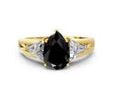 Yellow gold Three-Stone Fancy Black Pear Cut Cut Diamond Ring with Trillion Side Stones on a Split Shank Band