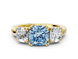 Yellow gold Three-Stone Fancy Blue Cushion Cut Cut Diamond Ring with Channel Set Band and Four-Prong Setting