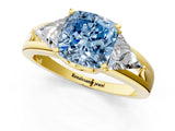 Yellow gold Three-Stone Fancy Blue Cushion Cut Cut Diamond Ring with Trillion Side Stones on a Split Shank Band_1