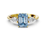 Yellow gold Three-Stone Fancy Blue Emerald Cut Brilliant Diamond Solitaire Ring with Tapered Band and Four-Prong Setting_12