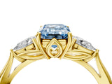 Yellow gold Three-Stone Fancy Blue Emerald Cut Brilliant Diamond Solitaire Ring with Tapered Band and Four-Prong Setting_16
