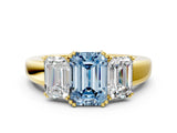 Yellow gold Three-Stone Fancy Blue Emerald Cut Cut Diamond Ring with Channel Set Band and Four-Prong Setting