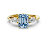 Yellow gold Three-Stone Fancy Blue Emerald Cut Diamond Ring with Pear  Side Stones in Four-Prong Setting_12
