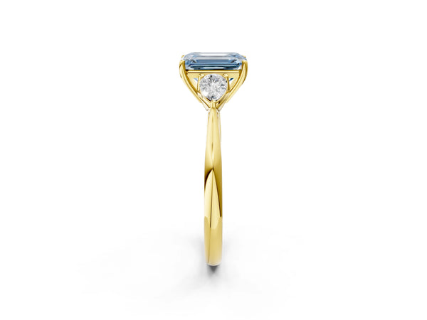 Yellow gold Three-Stone Fancy Blue Emerald Cut Diamond Ring with Pear  Side Stones in Four-Prong Setting