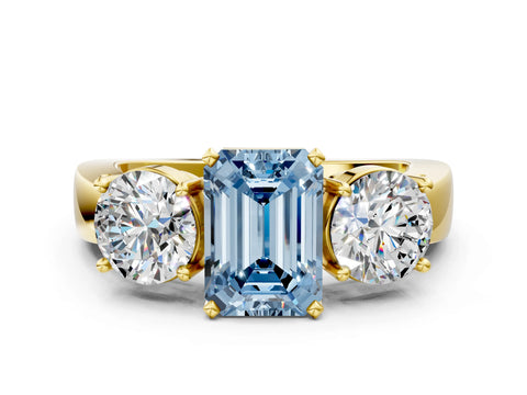 Yellow gold Three-Stone Fancy Blue Emerald Cut Diamond Ring with Round Side Stones, Classic Band, and Four-Prong Setting