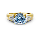 Yellow gold Three-Stone Fancy Blue Heart Cut Cut Diamond Ring with Trillion Side Stones on a Split Shank Band