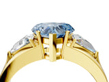 Yellow gold Three-Stone Fancy Blue Heart Cut Cut Diamond Ring with Trillion Side Stones on a Split Shank Band_4