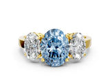 Yellow gold Three-Stone Fancy Blue Oval Cut Cut Diamond Engagement Ring with Flat Band and Four-Prong Setting